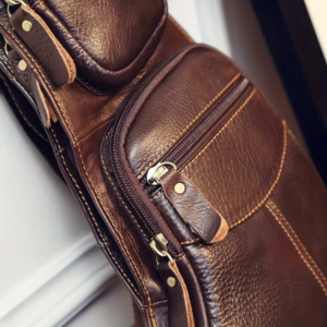 Rugged Vintage Leather Sling Bag - Fashionable Zippered Crossbody Style with Adjustable Strap - Versatile Unisex Bag for Daily Adventures